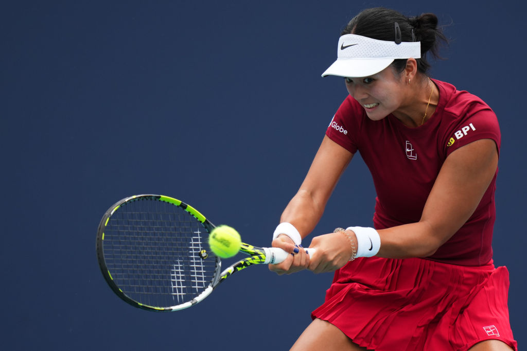 An image showing Alexandra Eala hitting a tennis